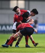 17 January 2017; Morgan Pembroke of The High School is tackled by Patrick O'Farrell, left, and Barry Mangan of CUS during the Bank of Ireland Fr Godfrey Cup Round 2 match between CUS and The High School at Donnybrook Stadium in Donnybrook, Dublin. Photo by Cody Glenn/Sportsfile