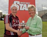 11 June 2011; President of the camogie association Joan Flynn presents the player of the match award Therese Maher, Galway, after the game. All-Ireland Senior Camogie Championship, Round One, Wexford v Galway, Bellefield, Enniscorthy, Co. Wexford. Picture credit: Barry Cregg / SPORTSFILE