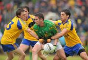 12 June 2011; Wayne McKeon, Leitrim, in action against Peter Domican, right, and Stephen Ormsby, Roscommon. Connacht GAA Football Senior Championship Semi-Final, Leitrim v Roscommon, Páirc Seán Mac Diarmada, Carrick-on-Shannon, Co. Leitrim. Picture credit: Barry Cregg / SPORTSFILE