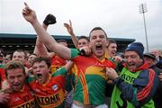 12 June 2011; Carlow's Darragh Foley celebrates with Padraig Murphy, 23, and Kieran Nolan, 7, after the final whistle. Leinster GAA Football Senior Championship Quarter-Final, Carlow v Louth, O'Moore Park, Portlaoise, Co. Laois. Picture credit: Matt Browne / SPORTSFILE