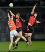 18 January 2017; Ben Crealey of Armagh trying to claim a mark against Cathal Magee and Niall Donnelly of Down during the Bank of Ireland Dr. McKenna Cup Section A Round 3 match between Armagh and Down at the Athletic Grounds in Armagh. Photo by Oliver McVeigh/Sportsfile