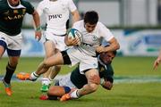 14 June 2011;  Tiernan O'Halloran, Ireland, is stopped by the South Africa defense. IRB Junior World Championship, Pool C, Ireland v South Africa, Stadio Communale di Monigo, Treviso, Italy. Picture credit: Roberto Bregani / SPORTSFILE