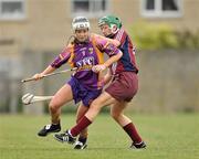 11 June 2011; Kate Kelly, Wexford, in action against Orla Kilkenny, Galway. All-Ireland Senior Camogie Championship, Round One, Wexford v Galway, Bellefield, Enniscorthy, Co. Wexford. Picture credit: Barry Cregg / SPORTSFILE