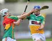 15 June 2011; Brian Carroll, Offaly, in action against Alan Corcoran, Carlow. Walsh Cup Shield Final, Carlow v Offaly, O'Moore Park, Portlaoise, Co. Laois. Picture credit: Matt Browne / SPORTSFILE