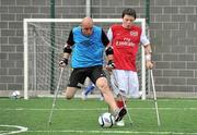 18 June 2010; Simon Baker, left, from Limerick, is tackled by James Boyle, from Donloe, Co. Donegal, during Ireland's first amputee football club training session. Mountview Communinty Sports Centre, Clonsilla, Co. Dublin. Picture credit: Brendan Moran / SPORTSFILE