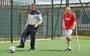 18 June 2010; Denis Hyland, Development Officer at the Football Association of Ireland, demonstrates technique to Paul Gale, from Swords, Co. Dublin, during Ireland's first amputee football club training session. Mountview Communinty Sports Centre, Clonsilla, Co. Dublin. Picture credit: Brendan Moran / SPORTSFILE