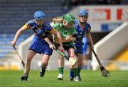 18 June 2011; Linda Sullivan, Offaly, in action against Julie Kirwan, left, and Geraldine Stapleton, right, Tipperary. All-Ireland Senior Camogie Championship, Round 2, in association with RTE Sport, Tipperary v Offaly, Semple Stadium, Thurles, Co. Tipperary. Picture credit: Barry Cregg / SPORTSFILE