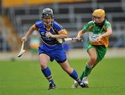 18 June 2011; Jill Horan, Tipperary, in action against Tina Hannon, Offaly. All-Ireland Senior Camogie Championship, Round 2, in association with RTE Sport, Tipperary v Offaly, Semple Stadium, Thurles, Co. Tipperary. Picture credit: Barry Cregg / SPORTSFILE