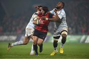 21 January 2017; Tyler Bleyendaal of Munster is tackled by left Etienne Dussartre of Racing 92 along with Leone Nakarawa during the European Rugby Champions Cup Pool 1 Round 6 match between Munster and Racing 92 at Thomond Park in Limerick. Photo by Diarmuid Greene/Sportsfile