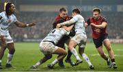 21 January 2017; Tommy O’Donnell of Munster is tackled by Teddy Thomas, left, and Brice Dulin of Racing 92 during the European Rugby Champions Cup Pool 1 Round 6 match between Munster and Racing 92 at Thomond Park in Limerick. Photo by Brendan Moran/Sportsfile