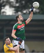 22 January 2017; Jason Gibbons of Mayo in action against Kevin Higgins of Roscommon during the Connacht FBD League Section A Round 3 match between Roscommon and Mayo at St. Brigids GAA Club in Kiltoom, Co. Roscommon.  Photo by Ramsey Cardy/Sportsfile