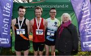 22 January 2017; Athletics Ireland president Georgina Drumm, right with men's intermediate medallists, from left, Ian Guiden of Clonliffe Harriers AC, bronze, Niall Sheehan of Gowran AC, gold, and Colin Maher of Ballyfin AC, silver, during the Irish Life Health Intermediate & Juvenile Inter Club Relay at Palace Grounds in Tuam, Co.Galway.  Photo by Sam Barnes/Sportsfile