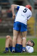 22 January 2017; Darragh Lyons of Waterford helps Charlie Chester to stretch out cramp during the Co-Op Superstores Munster Senior Hurling League Round 4 match between Waterford and Clare at Fraher Field in Dungarvan, Co Waterford. Photo by Seb Daly/Sportsfile