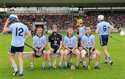 18 June 2011; Dublin players from left, Conal Keaney, 12, Shane Durkan, goalkeeper Gary Maguire, John McCaffrey, captain, Oisin Gough, yellow helmet, Tomas Brady, 3, and Perer Kelly, assemble for the team photograph. Leinster GAA Hurling Senior Championship Semi-Final, Dublin v Galway, O'Connor Park, Tullamore, Co. Offaly. Picture credit: Ray McManus / SPORTSFILE