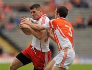 18 June 2011; Mark Lynch, Derry, in action against Brendan Donaghy, Armagh. Ulster GAA Football Senior Championship Semi-Final, Derry v Armagh, St Tiernach's Park, Clones, Co. Monaghan. Picture credit: Oliver McVeigh / SPORTSFILE