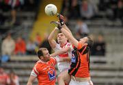 19 June 2011; Eoin Bradley, Derry, in action against Ciaran McKeever, left, and Paul Hearty, Armagh. Ulster GAA Football Senior Championship Semi-Final, Derry v Armagh, St Tiernach's Park, Clones, Co. Monaghan. Picture credit: Stephen McCarthy / SPORTSFILE