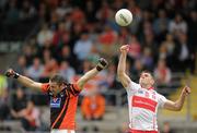 19 June 2011; Mark Lynch, Derry, in action against Paul Hearty, Armagh. Ulster GAA Football Senior Championship Semi-Final, Derry v Armagh, St Tiernach's Park, Clones, Co. Monaghan. Picture credit: Stephen McCarthy / SPORTSFILE