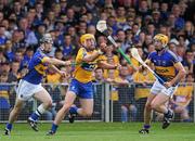 19 June 2011; John Conlon, Clare, in action against Gearoid Ryan, left, and Padraic Maher, Tipperary. Munster GAA Hurling Senior Championship Semi-Final, Clare v Tipperary, Gaelic Grounds, Limerick. Picture credit: Matt Browne / SPORTSFILE