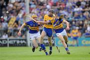 19 June 2011; Pat Vaughan, Clare, in action against Lar Corbett, 15, and David Young, Tipperary. Munster GAA Hurling Senior Championship Semi-Final, Clare v Tipperary, Gaelic Grounds, Limerick. Picture credit: Matt Browne / SPORTSFILE