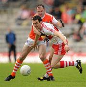 19 June 2011; Kevin McGuckin, Derry, in action against Steven McDonnell, Armagh. Ulster GAA Football Senior Championship Semi-Final, Derry v Armagh, St Tiernach's Park, Clones, Co. Monaghan. Picture credit: Stephen McCarthy / SPORTSFILE