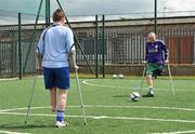 18 June 2010; Damien Hegarty, right, from Artane, Dublin, passes the ball to Craig Dowling, from Carlow town, during Ireland's first amputee football club training session. Mountview Communinty Sports Centre, Clonsilla, Co. Dublin. Picture credit: Brendan Moran / SPORTSFILE