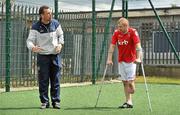 18 June 2010; Denis Hyland, left, Development Officer at the Football Association of Ireland, shows Paul Gale, from Swords, Co. Dublin, a drill during Ireland's first amputee football club training session. Mountview Communinty Sports Centre, Clonsilla, Co. Dublin. Picture credit: Brendan Moran / SPORTSFILE