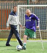 18 June 2010; Footballer Damien Hegarty, from Artane, Dublin, is watched by FAI Development Officer Denis Hyland, while taking part in drills during Ireland's first amputee football club training session. Mountview Communinty Sports Centre, Clonsilla, Co. Dublin. Picture credit: Brendan Moran / SPORTSFILE