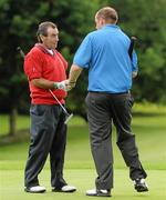13 June 2011; John Condie, from Antrim town, left, and Robert Paul, England, shake hands on completion of their rounds during the 1st Qualifying Round of the 74th World Open One Armed Championships. Co. Meath Golf Club, Newtownmoynagh, Trim, Co. Meath. Picture credit: Stephen McCarthy / SPORTSFILE
