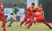 20 June 2011; Phelie Maguire, Ireland, in action against Cui Yongxin and Liu Yixian, right, China. UCD Men's 4 Nations Tournament, Ireland v China, UCD, Belfield, Dublin. Picture credit: Brendan Moran / SPORTSFILE