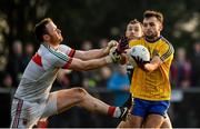 22 January 2017; Donie Smith of Roscommon is tackled by Rob Hennelly of Mayo during the Connacht FBD League Section A Round 3 match between Roscommon and Mayo at St. Brigids GAA Club in Kiltoom, Co. Roscommon.  Photo by Ramsey Cardy/Sportsfile