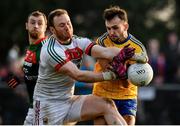 22 January 2017; Donie Smith of Roscommon is tackled by Rob Hennelly of Mayo during the Connacht FBD League Section A Round 3 match between Roscommon and Mayo at St. Brigids GAA Club in Kiltoom, Co. Roscommon.  Photo by Ramsey Cardy/Sportsfile
