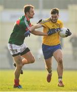 22 January 2017; Ultan Harney of Roscommon in action against Jason Gibbons of Mayo the Connacht FBD League Section A Round 3 match between Roscommon and Mayo at St. Brigids GAA Club in Kiltoom, Co. Roscommon. Photo by Ramsey Cardy/Sportsfile