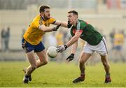 22 January 2017; Michael Plunkett of Mayo is tackled by Tom Corcoran of Roscommon during the Connacht FBD League Section A Round 3 match between Roscommon and Mayo at St. Brigids GAA Club in Kiltoom, Co. Roscommon.  Photo by Ramsey Cardy/Sportsfile