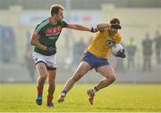22 January 2017; Ultan Harney of Roscommon in action against Jason Gibbons of Mayo the Connacht FBD League Section A Round 3 match between Roscommon and Mayo at St. Brigids GAA Club in Kiltoom, Co. Roscommon. Photo by Ramsey Cardy/Sportsfile