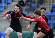 24 January 2017; Luke Fitzpatrick of Wesley College hands off the tackle of Patrick O’Farrell of Catholic University School during the Bank of Ireland Fr Godfrey Cup Semi-Final match between Wesley College and Catholic University School at Donnybrook Stadium in Donnybrook, Dublin. Photo by Eóin Noonan/Sportsfile