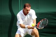 21 June 2011; Conor Niland, Ireland, in action against Adrian Mannarino, France, during their opening round match. Wimbledon 2011 Gentlemen's Singles Championship Round 1, Adrian Mannarino v Conor Niland, All England Lawn Tennis and Croquet Club, London, England. Picture credit: Ian MacNicol / SPORTSFILE