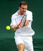 21 June 2011; Conor Niland, Ireland, in action against Adrian Mannarino, France, during their opening round match. Wimbledon 2011 Gentlemen's Singles Championship Round 1, Adrian Mannarino v Conor Niland, All England Lawn Tennis and Croquet Club, London, England. Picture credit: Ian MacNicol / SPORTSFILE