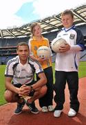 21 June 2011; Ulster Bank GAA star Craig Dias with Sarah Nugent and John Joe Hunter, both pupils, from St.Patrick's Primary School, Armagh, in Croke Park as part of the Ulster Bank/Irish News competition where five lucky classes won a school trip of a lifetime which included a tour of the famous Croke Park Stadium while also meeting some of the biggest GAA stars in the country. Croke Park, Dublin. Picture credit: David Maher / SPORTSFILE