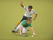 24 June 2011; David Ames, Ireland, in action against Waseem Ahmed, Pakistan. UCD Men's 4 Nations Tournament, Ireland v Pakistan, National Hockey Stadium, UCD, Belfield, Dublin. Photo by Sportsfile