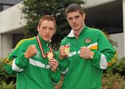 25 June 2011; Ray Moylette, left, and Joe Ward show off their gold medals at Dublin Airport upon their arrival home from the European Boxing Championships in Turkey. Dublin Airport, Co. Dublin. Picture credit: Barry Cregg / SPORTSFILE