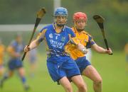 25 June 2011; Julie Kirwan, Tipperary, in action against Deirdre Murphy, Clare. All-Ireland Senior Camogie Championship Round 3 in association with RTE Sport, Clare v Tipperary, Clarecastle GAA Club, Clarecastle, Co. Clare. Picture credit: Pat Murphy / SPORTSFILE