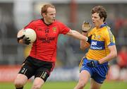25 June 2011; Brendan Coulter, Down, in action against Kevin Hartnett, Clare. GAA Football All-Ireland Senior Championship Qualifier Round 1, Clare v Down, Cusack Park, Ennis, Co. Clare. Picture credit: Pat Murphy / SPORTSFILE