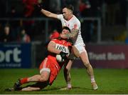 28 January 2017; Mark Lynch Derry in action against Cathal McCarron of Tyrone during the Bank of Ireland Dr. McKenna Cup Final match between Tyrone and Derry at Pairc Esler in Newry, Co. Down. Photo by Oliver McVeigh/Sportsfile