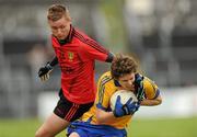 25 June 2011; Kevin Hartnett, Clare, in action against Caolan Mooney, Down. GAA Football All-Ireland Senior Championship Qualifier Round 1, Clare v Down, Cusack Park, Ennis, Co. Clare. Picture credit: Pat Murphy / SPORTSFILE