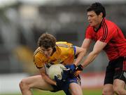 25 June 2011; Kevin Hartnett, Clare, in action against Martin Clarke, Down. GAA Football All-Ireland Senior Championship Qualifier Round 1, Clare v Down, Cusack Park, Ennis, Co. Clare. Picture credit: Pat Murphy / SPORTSFILE