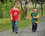 25 June 2011; Louth supporter DJ McKeever, age 9, with his brother Oisin, age 5, wearing a  Meath jersey, from Ardee, Co. Louth. GAA Football All-Ireland Senior Championship Qualifier Round 1, Louth v Meath, Kingspan Breffni Park, Co. Cavan. Picture credit: David Maher / SPORTSFILE