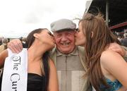 25 June 2011; Chantelle Bowers, left, and Amy Lawless kiss punter Shay Godfrey, Finglas. Horse Racing, The Curragh Racecourse, The Curragh, Co. Kildare. Picture credit: Ray Lohan / SPORTSFILE