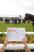 25 June 2011; A general view of a punter studying the racecard at the Curragh Racecourse, The Curragh, Co. Kildare. Picture credit: Ray Lohan / SPORTSFILE