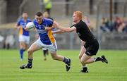 25 June 2011; Leighton Glynn, Wicklow, is tackled by Ross Donovan, Sligo. GAA Football All-Ireland Senior Championship Qualifier Round 1, Wicklow v Sligo, County Grounds, Aughrim, Co. Wicklow. Picture credit: Matt Browne / SPORTSFILE