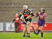 25 June 2011; Áine Fahy, Kilkenny, in action against Catherine O'Loughlin, left, and Claire O'Connor, Wexford. All-Ireland Senior Camogie Championship Round 3 in association with RTE Sport, Wexford v Kilkenny, Wexford Park, Co. Wexford. Picture credit: Barry Cregg / SPORTSFILE